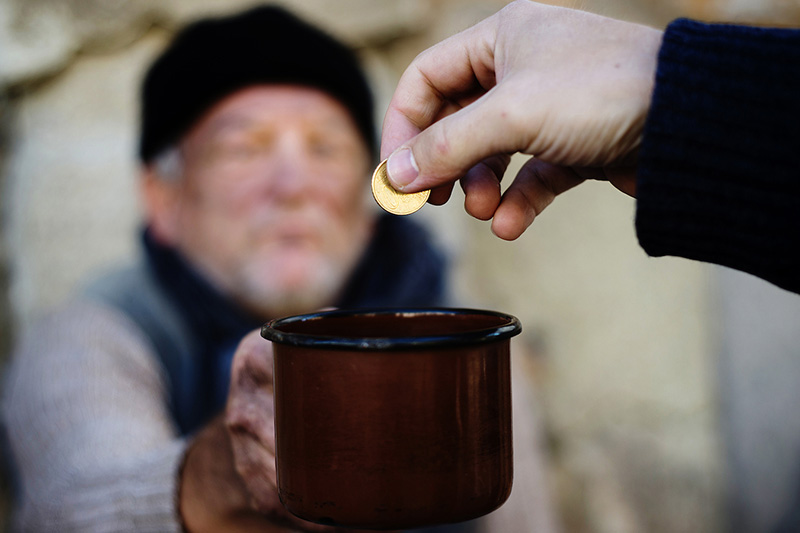 Tzedakah in Adar - coin and cup